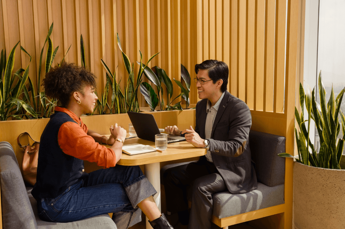 Two colleagues discussing change enablement implementation.