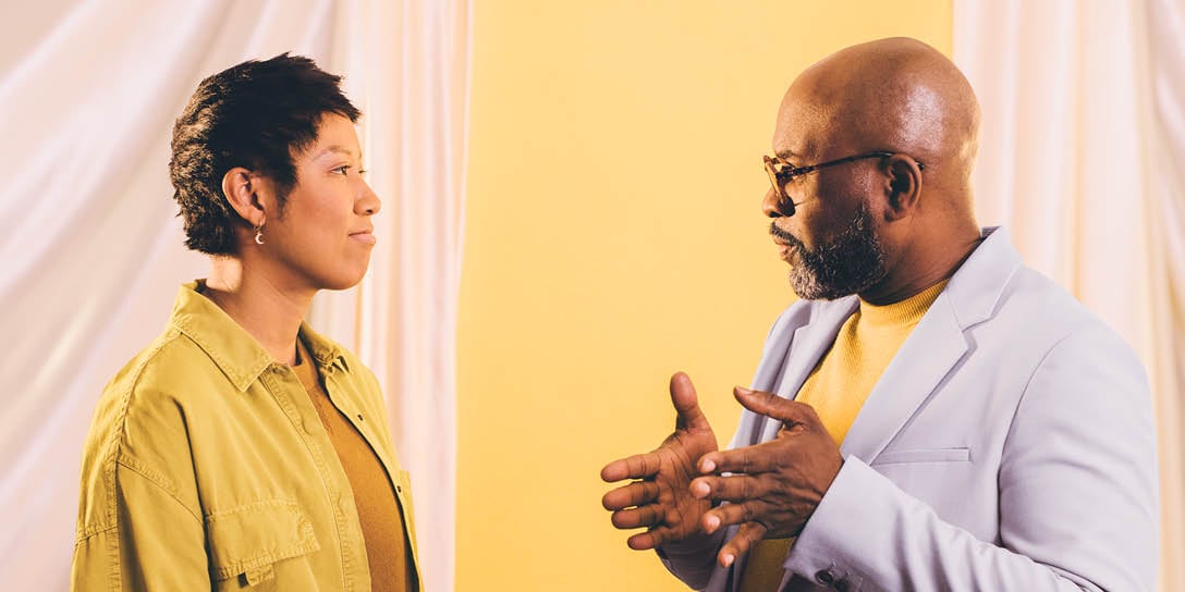 Two individuals having a conversation on how to provide better internal customer service.