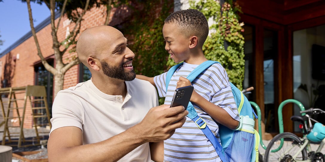 A parent uses their phone to speak with a customer service agent.